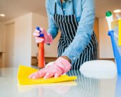 Close-up of woman cleaning her house.