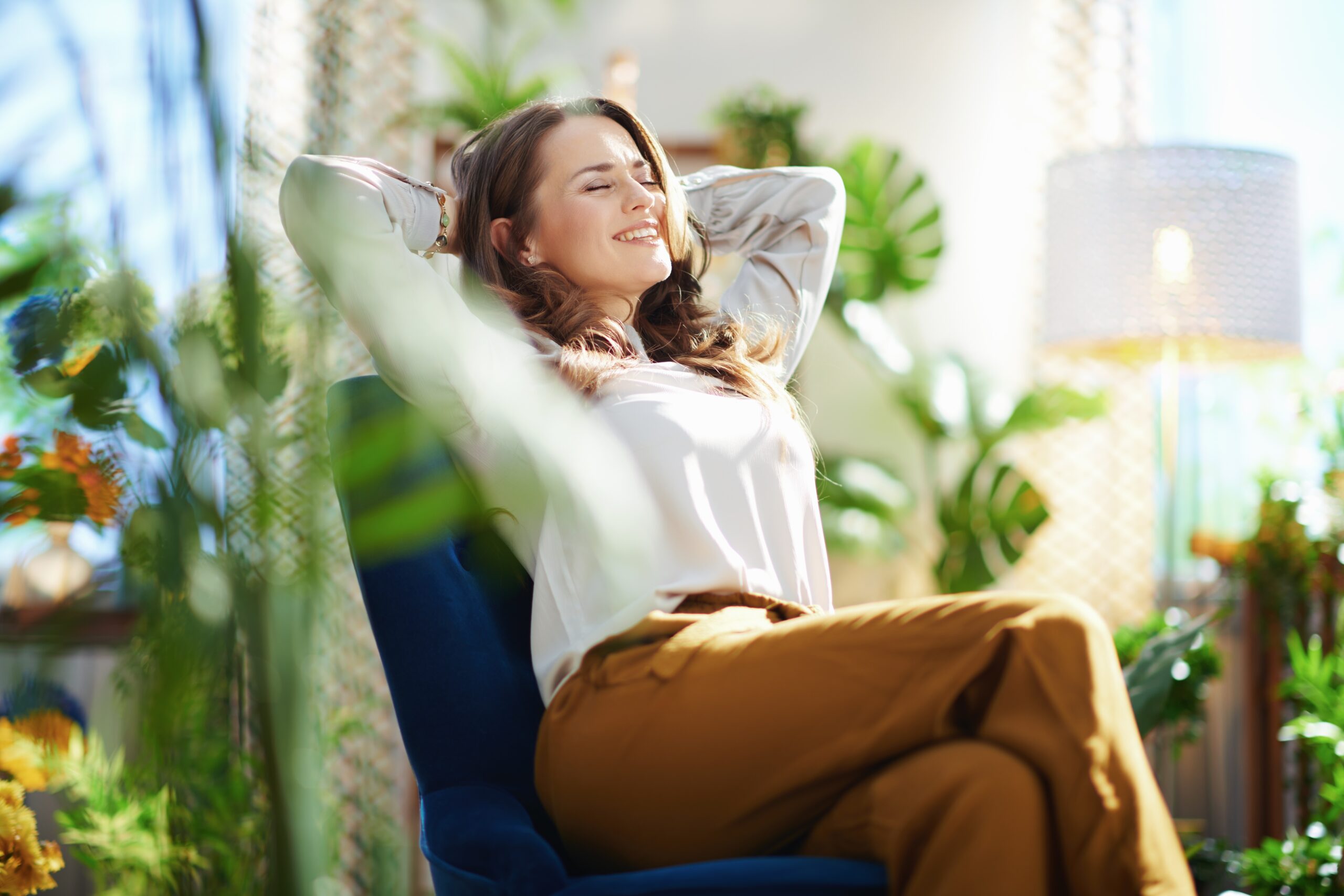 Green,Home.,Relaxed,Stylish,Woman,With,Long,Wavy,Hair,At